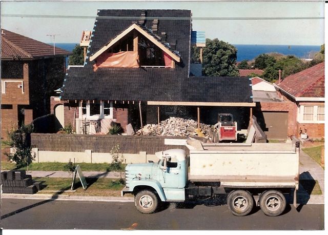 Diamond T boogie tipper and bobcat removing rubble early days