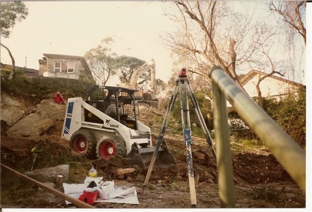 bobcat at the bottom of large trench