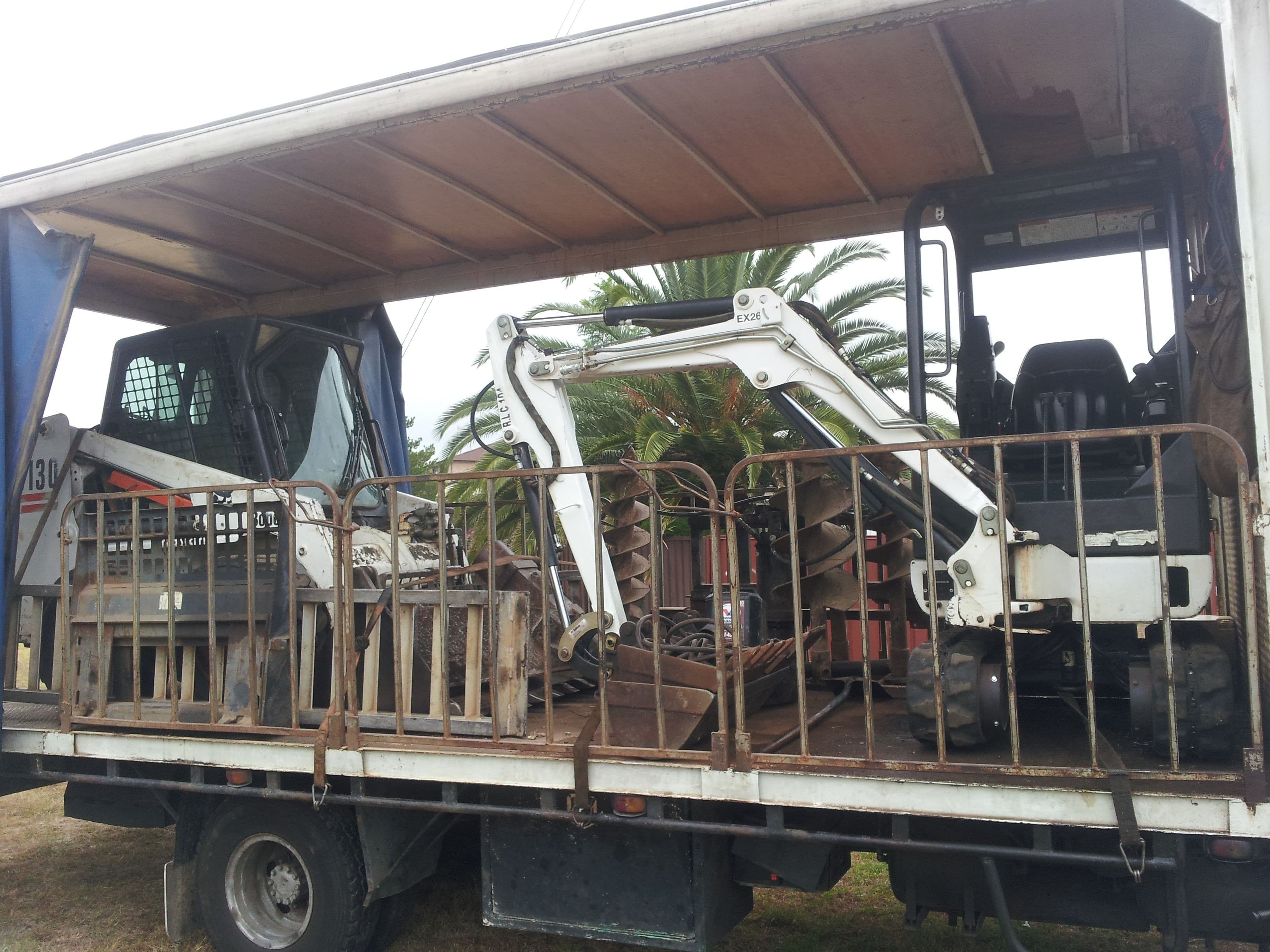 excavator bobcat combination with auger